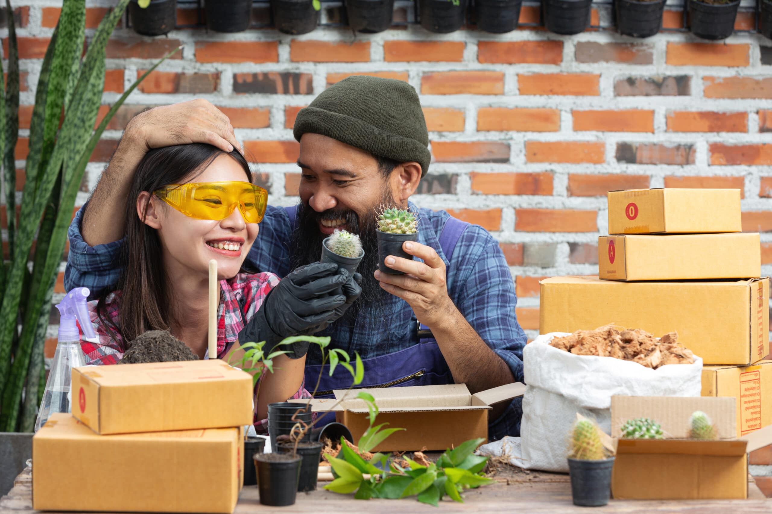 selling plant online; couples smiling while growing plants